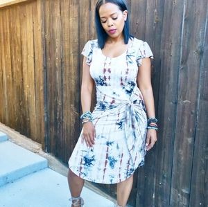 Tie dye dress with tie detailing.Tan and navy blue